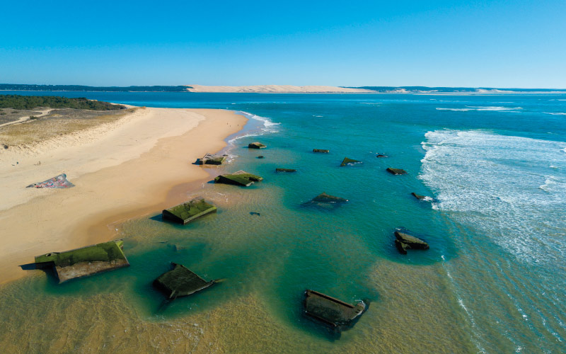 blockhaus plage du cap ferret dans l'eau turquoise
